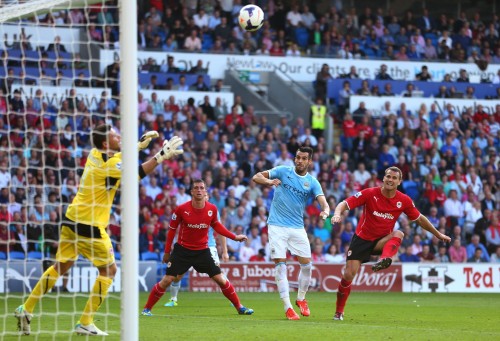 CARDIFF, WALES - AUGUST 25:  Alvaro Negredo of Manchester City scores his team's second goal deep in second half injury time during the Barclays Premier League match between Cardiff City and Manchester City  at Cardiff City Stadium on August 25, 2013 in Cardiff, Wales.  (Photo by Michael Steele/Getty Images)